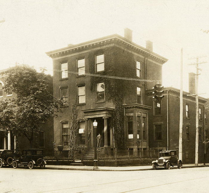 photograph of house on a street corner