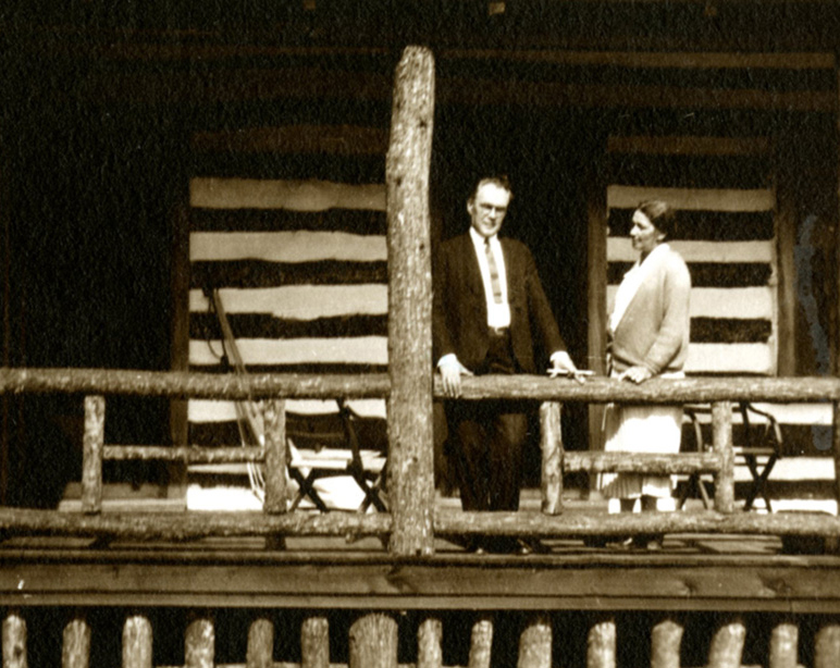 James and Percie Cabell stand on the porch of a cabin