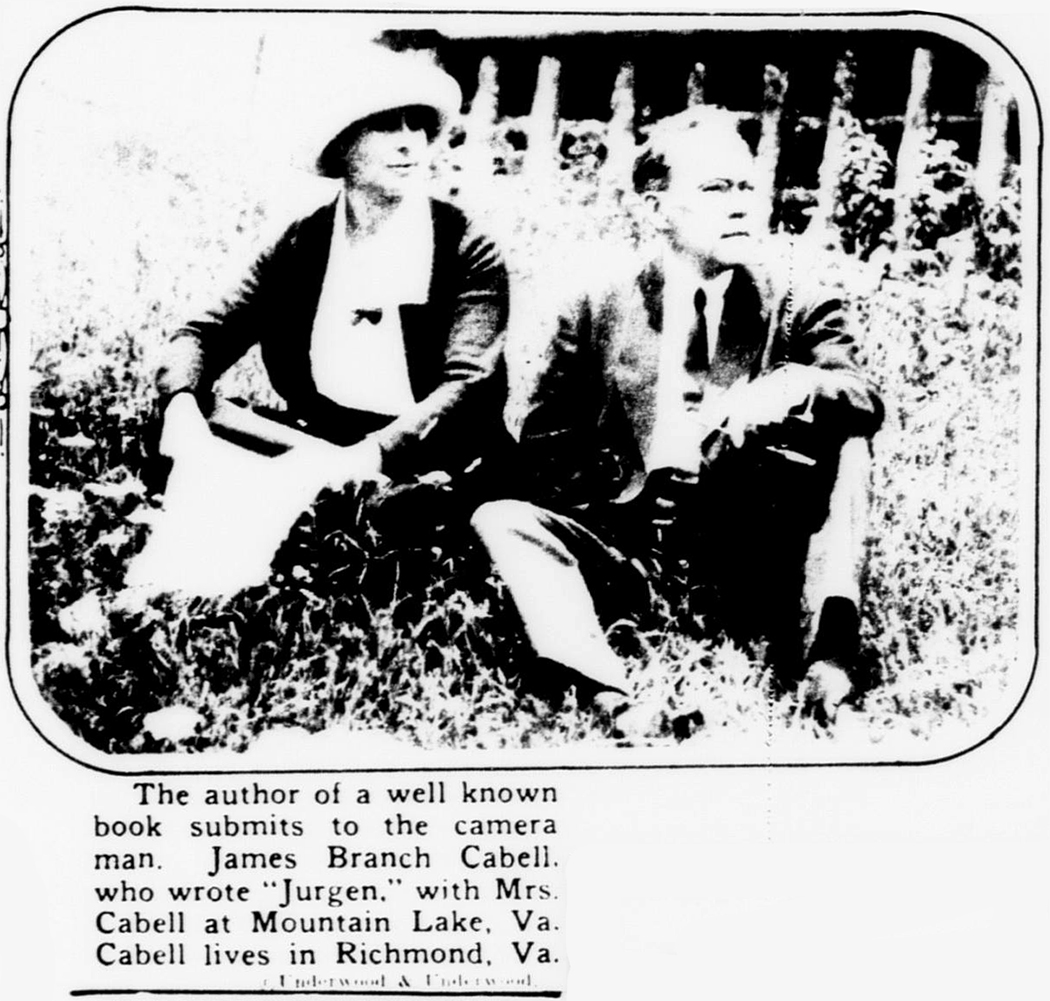 Cabell and his wife Priscilla sit in the grass before the cabin at Mountain Lake