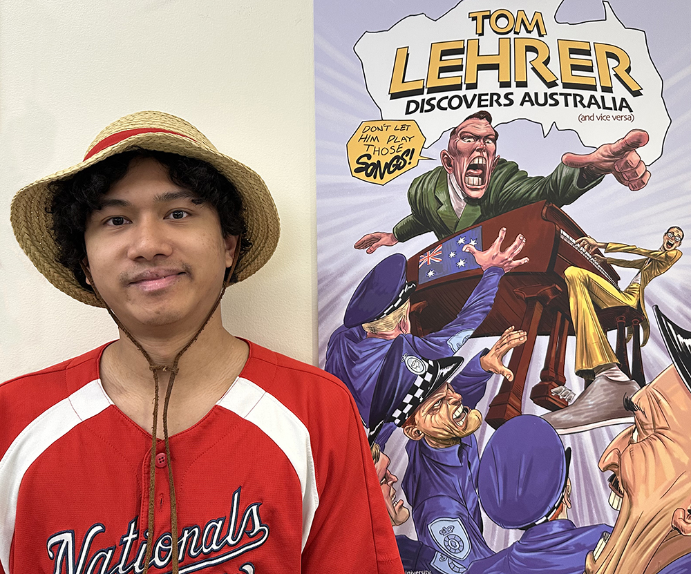 Johnny Eusoof, 2026 Grand Prize winner, stands next to his winning comic book cover artwork